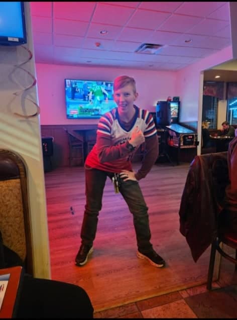 Fan in red, white, and blue at a sports watch party
